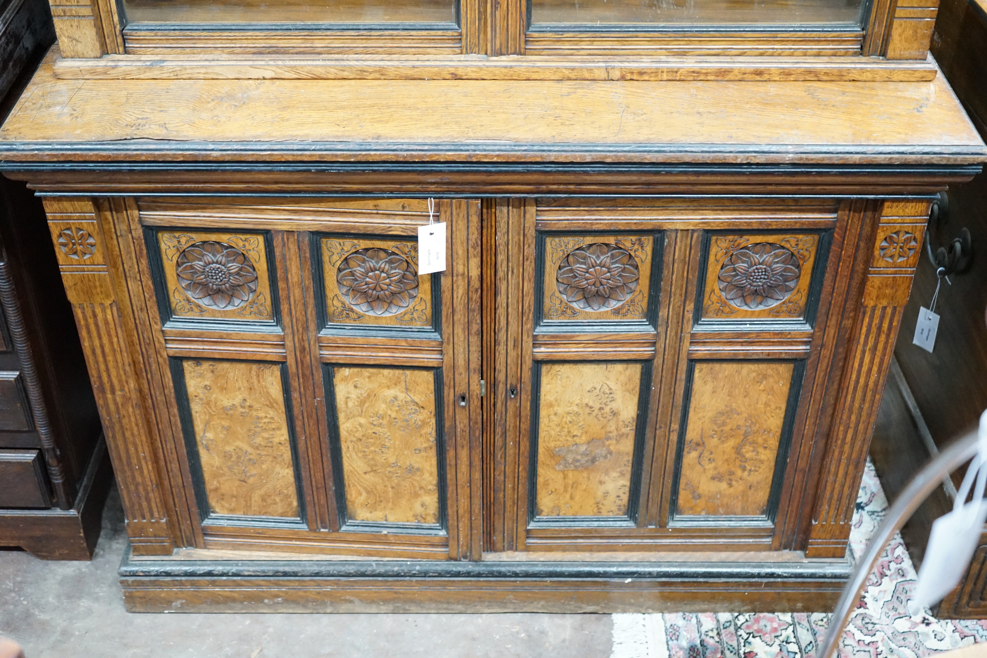 A late Victorian Aesthetic movement oak and pollard oak bookcase, width 114cm depth 50cm height 262cm